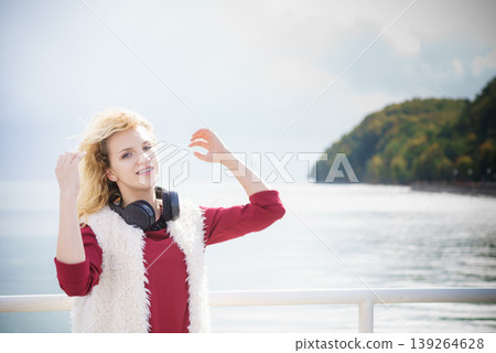 Happy woman wearing headphones outdoor Happy woman wearing headphones outdoor 139264628