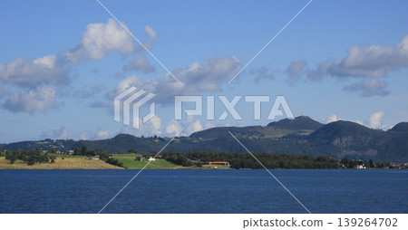 Blue sea, agricultural land and mountains in Rogaland, Norway. Blue sea, agricultural land and mountains in Rogaland, Norway. 139264702