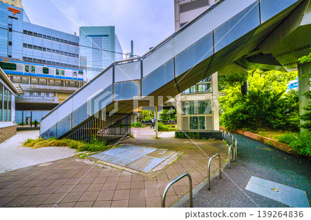 A view of the urban landscape of Yokohama, Japan, including the "Original Landmark of the Birthplace of Railways" (bottom right of the screen) located in front of the new south exit (city hall exit) of Sakuragicho Station. A view of the urban landscape of Yokohama, Japan, including the "Original Landmark of the Birthplace of Railways" (bottom right of the screen) located in front of the new south exit (city hall exit) of Sakuragicho Station. 139264836