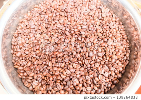 Roasted coffee beans in a metal container Roasted coffee beans in a metal container 139264838