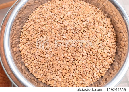 Roasted coffee beans in a metal container Roasted coffee beans in a metal container 139264839