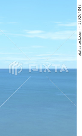 Smoothly rendered sea and sky through long exposure: A minimalist landscape of Izu Oshima Island viewed from Inamuragasaki. Smoothly rendered sea and sky through long exposure: A minimalist landscape of Izu Oshima Island viewed from Inamuragasaki. 139264848