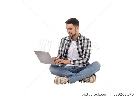 Young man happily using a laptop casually, isolated, PNG Young man happily using a laptop casually, isolated, PNG 139265170