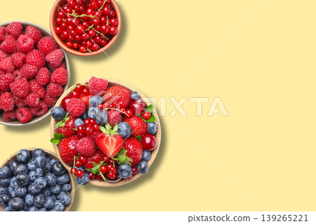 Bowls filled with mixed berries on a flat surface Bowls filled with mixed berries on a flat surface 139265221