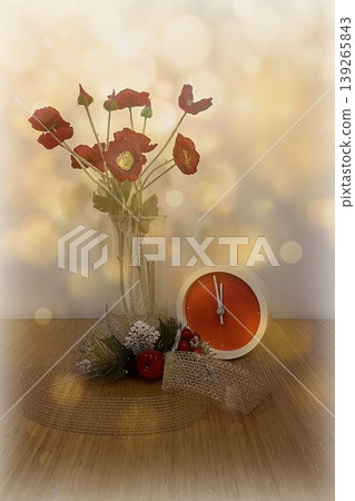 New Year Countdown Still Life with Clock and Red Flowers. A festive scene featuring a modern red clock at five minutes to midnight, paired with red poppies and winter decor. New Year Countdown Still Life with Clock and Red Flowers. A festive scene featuring a modern red clock at five minutes to midnight, paired with red poppies and winter decor. 139265843