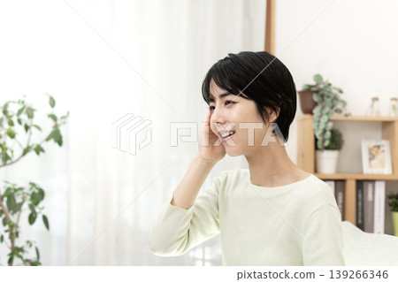 A young woman, having recovered from illness, shows a bright smile. A young woman, having recovered from illness, shows a bright smile. 139266346