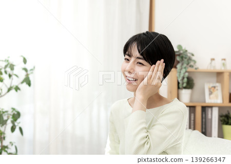A young woman, having recovered from illness, shows a bright smile. A young woman, having recovered from illness, shows a bright smile. 139266347