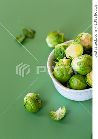 organic green brussels sprouts in bowl with natural herb garnish 139266518