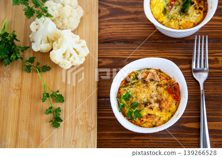 baked omelet with cauliflower and herbs served in white ramekin baked omelet with cauliflower and herbs served in white ramekin 139266528