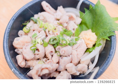 Green onions with condiments served in a black bowl with ponzu sauce Green onions with condiments served in a black bowl with ponzu sauce 139266815