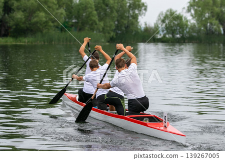 Rear view four athletes canoeist Rear view four athletes canoeist 139267005