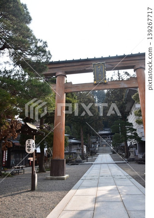The torii gate and lanterns of Sakurayama Hachimangu Shrine in Takayama City, Gifu Prefecture, Japan, during the morning scene of the Spring Takayama Festival. The torii gate and lanterns of Sakurayama Hachimangu Shrine in Takayama City, Gifu Prefecture, Japan, during the morning scene of the Spring Takayama Festival. 139267717
