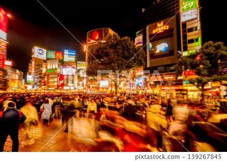 A panning shot of the extremely crowded Shibuya Scramble Crossing. A panning shot of the extremely crowded Shibuya Scramble Crossing. 139267845