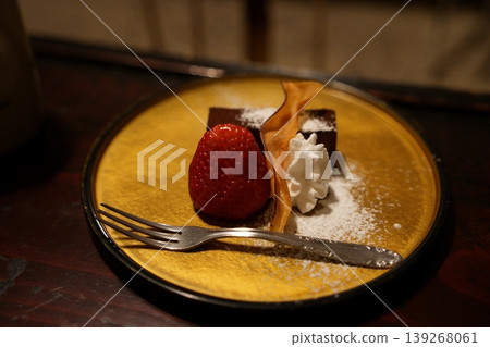 A strawberry and chocolate cake dessert to enjoy after dinner at a hot spring inn in winter. A strawberry and chocolate cake dessert to enjoy after dinner at a hot spring inn in winter. 139268061