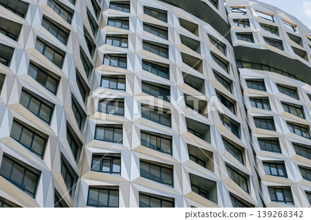 Futuristic building facade with geometric panels Futuristic building facade with geometric panels 139268342