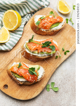 Smoked salmon toast with avocado and cream cheese Smoked salmon toast with avocado and cream cheese 139268913
