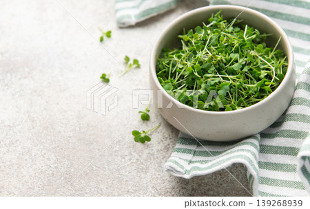 Fresh microgreens in bowl promoting healthy eating Fresh microgreens in bowl promoting healthy eating 139268939