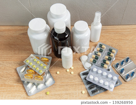 Medicine bottles and blister packs with various pills and capsules Medicine bottles and blister packs with various pills and capsules 139268950