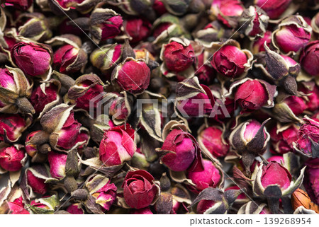 Dried rose buds creating fragrant herbal tea concept Dried rose buds creating fragrant herbal tea concept 139268954