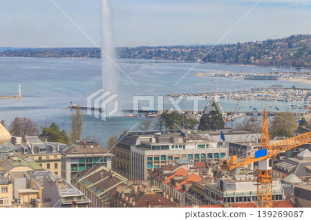 Panoramic view of city of Geneva, Lake Geneva and Jet d'Eau fountain in Switzerland. View from the bell tower of Saint Pierre Cathedral 139269087