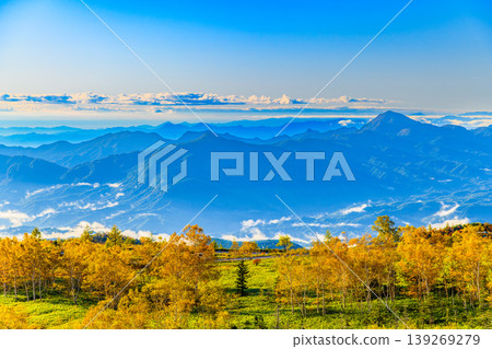 A spectacular view of the Kanto Plain and the colorful mountain slopes seen through a sea of clouds from the Shiga-Kusatsu Plateau Route. A spectacular view of the Kanto Plain and the colorful mountain slopes seen through a sea of clouds from the Shiga-Kusatsu Plateau Route. 139269279