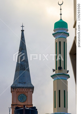 Christian church and minaret of the mosque side by side in Stone Town, Zanzibar, Tanzania Christian church and minaret of the mosque side by side in Stone Town, Zanzibar, Tanzania 139269300