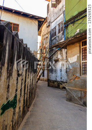 Typical narrow street in Stone Town, Zanzibar, Tanzania Typical narrow street in Stone Town, Zanzibar, Tanzania 139269325