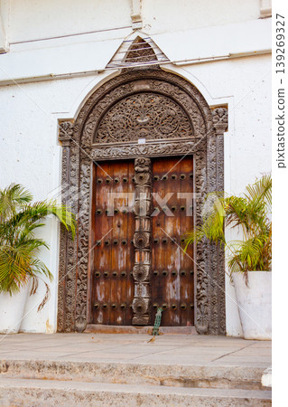 Traditional wooden carved door in Stone Town, Zanzibar, Tanzania Traditional wooden carved door in Stone Town, Zanzibar, Tanzania 139269327