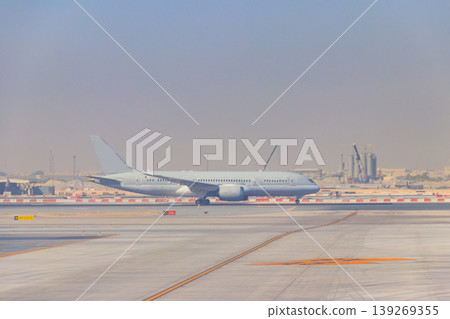 Airplane on runway in Doha airport, Qatar Airplane on runway in Doha airport, Qatar 139269355