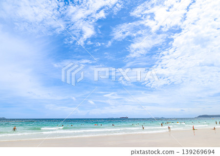 A beach under a clear blue sky 139269694