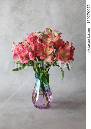 Alstroemeria arranged in a glass bottle Alstroemeria arranged in a glass bottle 139270075