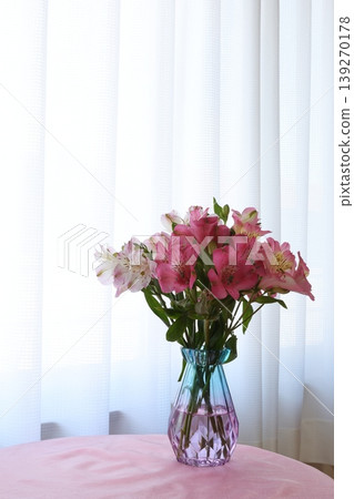Alstroemeria arranged in a glass bottle Alstroemeria arranged in a glass bottle 139270178