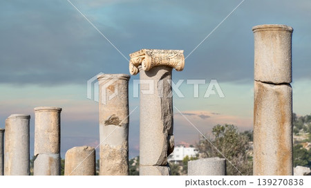 A row of ancient Ionic columns lining the colonnaded street at Patara archaeological site, Antalya, Turkey 139270838