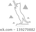 A cat trying to grab something 139270882