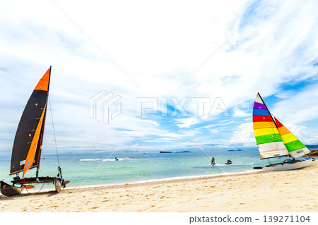 A beach with sailing boats and a blue ocean 139271104