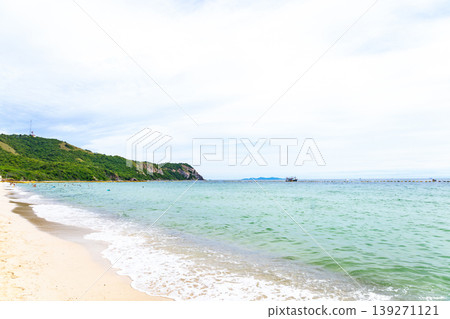 A beach with a wide expanse of blue ocean 139271121