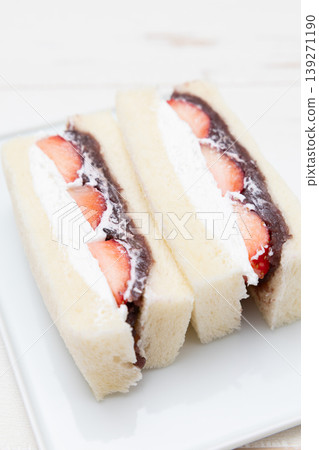 Strawberry and red bean cream sandwich filled with delicious strawberries, fresh cream, and red bean paste. 139271190