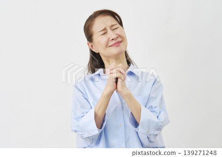 Elderly woman begging on white background 139271248