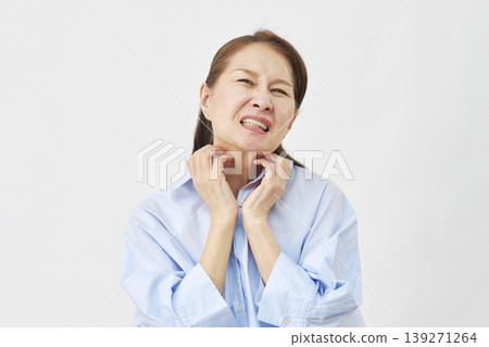 A woman scratching her neck on a white background A woman scratching her neck on a white background 139271264
