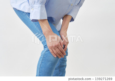 Senior woman, knee pain, white background, no face. Senior woman, knee pain, white background, no face. 139271269