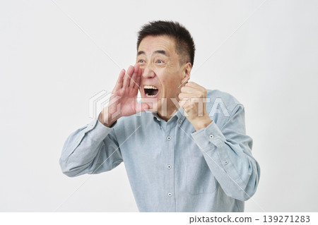 A man cheering against a white background, facing left. A man cheering against a white background, facing left. 139271283