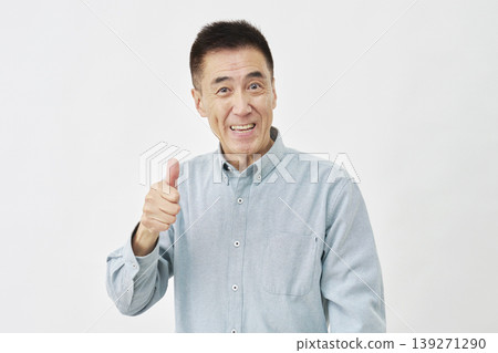 A man giving a thumbs up sign on a white background A man giving a thumbs up sign on a white background 139271290