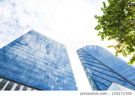 Landscape of the office town looking up at a skyscraper Landscape of the office town looking up at a skyscraper 139271500