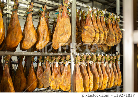 Legs of Spanish jamon ready for sale in grocery Legs of Spanish jamon ready for sale in grocery 139271837