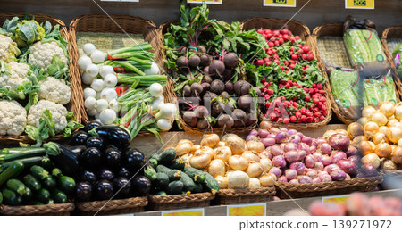 Row of display cases filled with vegetables in store Row of display cases filled with vegetables in store 139271972