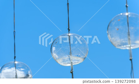 Transparent Edo wind chimes swaying in the blue sky, and the coolness of summer Transparent Edo wind chimes swaying in the blue sky, and the coolness of summer 139272098