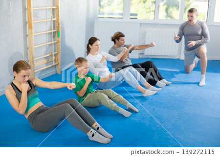 Family pupils performs exercises to strengthen press and improve accuracy of hands Family pupils performs exercises to strengthen press and improve accuracy of hands 139272115