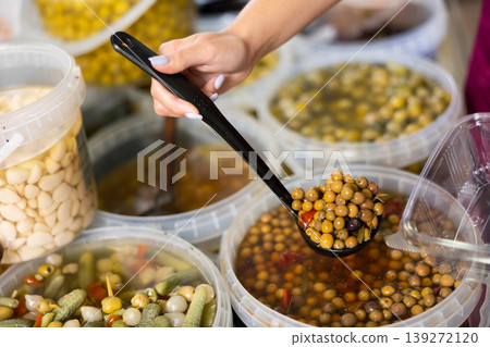 Salted olives in a container at the market Salted olives in a container at the market 139272120