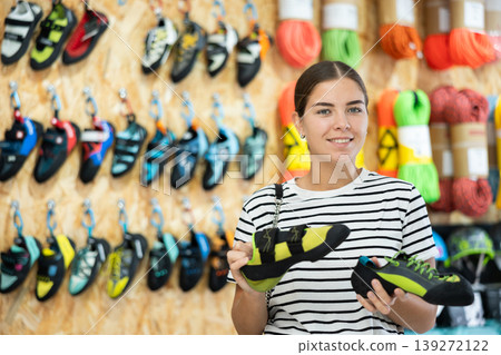 Girl choose summer shoes for hiking Girl choose summer shoes for hiking 139272122