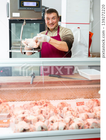 Positive seller offers to buy chicken carcasses in grocery store Positive seller offers to buy chicken carcasses in grocery store 139272220